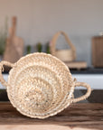 Petit panier ARTIZAN rond en feuille de palmier avec anses tressées