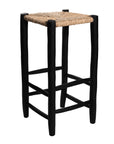 Tabouret en bois peint en noir à utiliser autour d'un mange debout