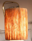 Lampe chevet TANA NOIR allumée – lumière douce enveloppante raphia filé ambiance bohème chaleureuse